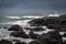 Sea waves hitting the natural hexagonal stones at the coast called Giant`s Causeway, a landmark in Northern Ireland