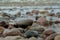 Sea waves lash line impact rock on the beach