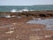 Sea waves and Laterite rock Red Jambha stone on Bhogwe beach