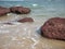 Sea waves and Laterite rock Red Jambha stone on Bhogwe beach