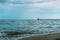 Sea waves at Odessa beach with lighthouse