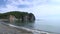 Sea waves surf on stony rocks beach. Japan Sea.