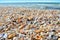 Sea waves washed clean beach made of shells. Landscape on a wild beach.