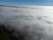 Sea of white clouds above Rioja Alavesa valley as seen from sunny point of view Balcon De La Rioja, Spain in winter