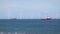 Sea wind farm turbines and ships in Aberdeen, renewable energy. Scotland