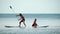 Sea woman and man sup. Silhouette of happy young woman and man, surfing on SUP board, confident paddling through water