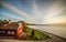 Sea and wooden house, sunset sky