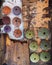 Sea worn wood pieces and colorful sea urchin shells top view closeup.