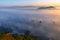 The sea of â€‹â€‹mist in the winter morning covers the village below in Li District, Lamphun Province, Thailand