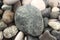 Sea â€‹â€‹pebbles and round large stone