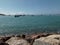 Sea â€‹â€‹view with rocks and some fishing boats