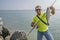 Seabass fishing. Fisherman with sea bass fish. Man with fishing tackle at coast line