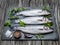 Seabass on a graphite board with spices and herbs.