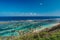 Seacoast and blue ocean with paraglider in tropical island