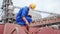 Seafarer checks protective lead seal to safely lock cargo holds with wheat on bulker ship at sea grain terminal in