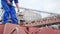 Seafarer checks protective lead seal to safely lock cargo holds with wheat on bulker ship at sea grain terminal in