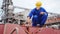 Seafarer checks protective lead seal to safely lock cargo holds with wheat on bulker ship at sea grain terminal in