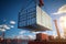 Seafaring commerce Crane lifts cargo container onto a nautical vessel