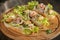 Seafood bruschetta topped with fresh salad, shrimp, octopus, mussel