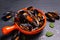 Seafood concept Mussels in orange handle bowl on black slate stone with copy space