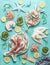 Seafood concept. Various seafood on light blue background, decorated with seaweeds , top view