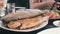 Seafood Cooked Fried Fish Trout on a Plate in a Restaurant