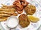 Seafood Feast With Crab Cakes, Spiced Shrimp, Baked Fries, Lemon and Horse Radish Sauce