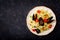 Seafood fettuccine pasta with mussels over black background