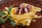 Seafood Fettuccine pasta with octopus, garnished with basil on a clay plate and fabric background