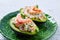 Seafood filled avocado with shrimps tapas pinchos