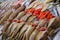 Seafood market stall with different kinds of fishes on ice in dubai