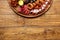 Seafood and meat platter on wooden table background