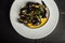 Seafood mussels on pan with cream sauce. Restaurant food. Close up