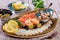 Seafood platter. Fresh cod liver, salmon, shrimp, slices fish fillet, decorated with herb, lemon