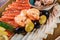 Seafood platter. Fresh cod liver, salmon, shrimp, slices fish fillet, decorated with herb, lemon and olives
