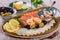 Seafood platter. Fresh cod liver, salmon, shrimp, slices fish fillet, decorated with herb, lemon and olives