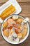 seafood porridge with crabs and shrimps and white shells and deep-fried dough sticks