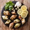 Seafood: raw whelk, sea snails bulot with a garlic and parsley,