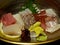 Seafood: Sashimi and Seaweed Served on Plate.