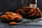 Seafood shrimp lie in plate, dark background. crab hairy, bottle of champagne and glass. Concept grilled dinner