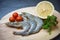 Seafood shrimps on cutting board / Fresh prawns ocean gourmet raw shrimp with tomato lemon and green parsley