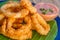 Seafood snacks, calamaris, squid rings in outdoor restaur