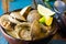 Seafood soup of clams Paila marina in clay bowl