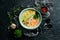 Seafood soup. Creamy tuna soup in a bowl on a black stone background. Top view. Rustic style