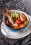 Seafood soup with langoustine, mussels, squid, fillet salmon, shrimp and celery in bowl over dark background. Healthy food, diet