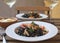 Seafood Squid ink pasta closeup Shrimp White wine Alioli Restaurant terrace Wooden table