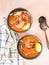 Seafood tomato soup in blue ceramic bowls. Mediterranean cuisine