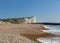 Seaford beach, waves and white chalk cliffs East Sussex UK