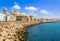 Seafront view of Cadiz with cathedral and street in the background, Cadiz, Spain