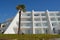 Seafront White Washed Holiday Hotel with Palm Tree